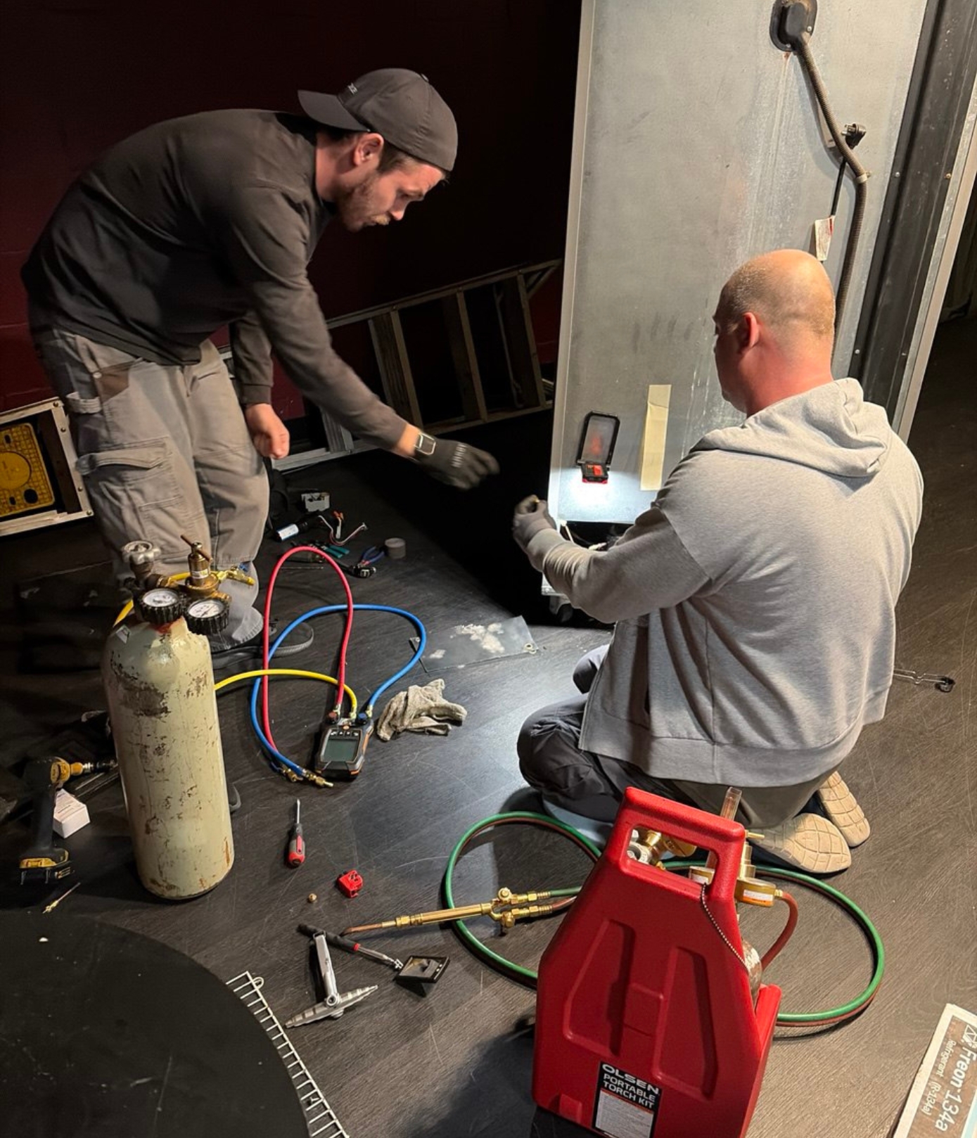 A11 technicians performing sealed system repair on an Everest commercial refrigerator in Glendale